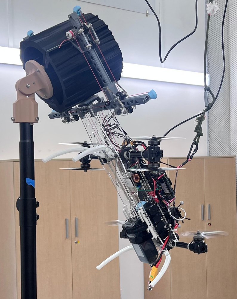 A Tilt-Rotor UAV with a Gripper for Stable Contact-Based Tasks via Environmental Anchoring Figure 1
