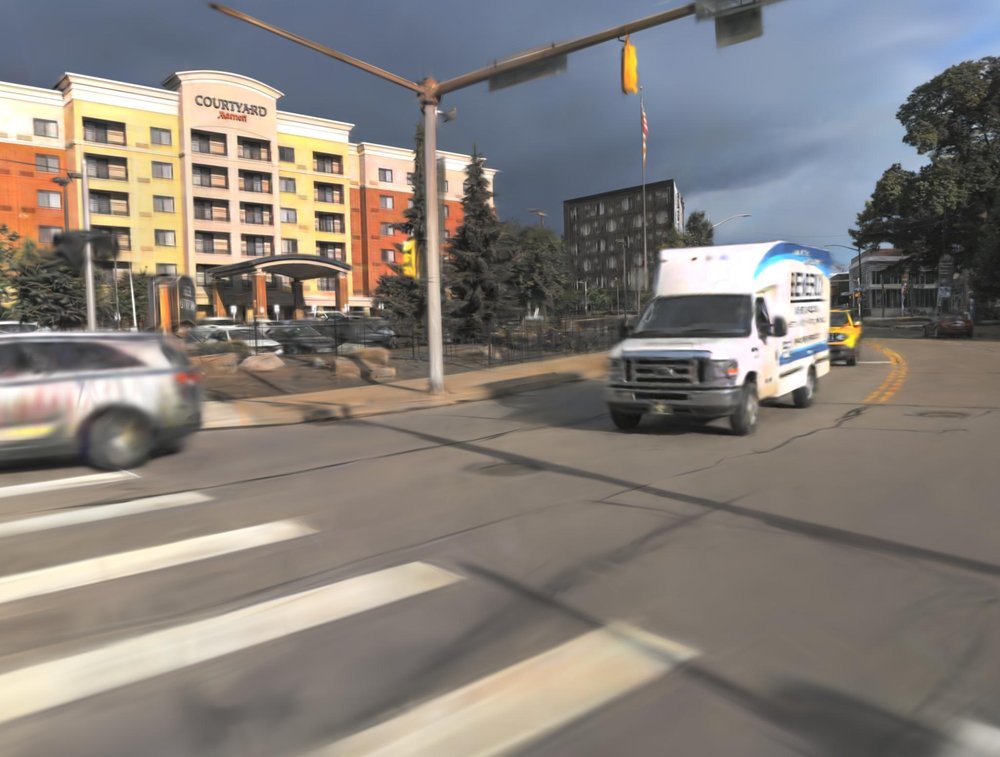 Dynamic 3D Gaussian Fields for Urban Areas Figure 1