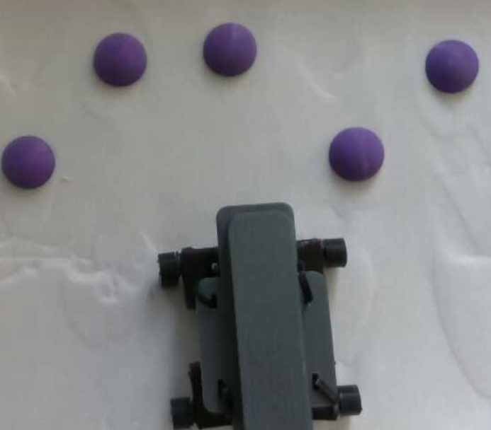 Granular loco-manipulation: Repositioning rocks through strategic sand avalanche