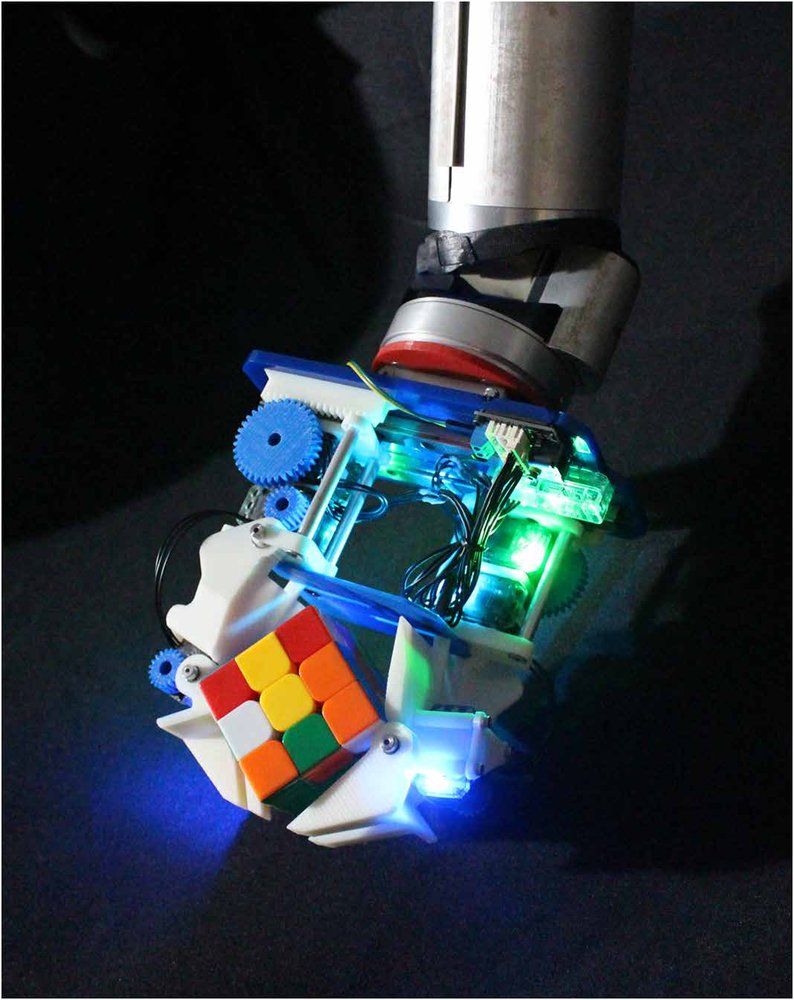 Complex manipulation with a simple robotic hand through contact breaking and caging Figure 1